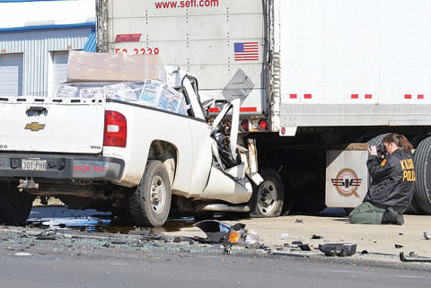 A 20 year-old man was killed when the pickup truck he was driving rear-ended a semi truck in Kilgore, TX on January 18, 2013. Photo credit: James Draper / News Herald