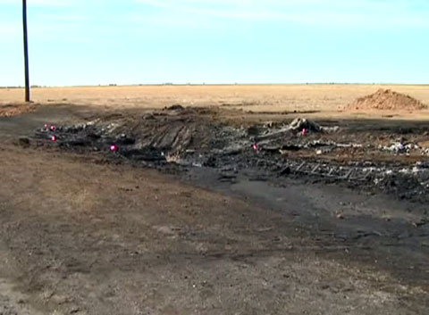 Roadside with charred remains where five teens were killed in a fiery crash with a gasoline tanker truck in Dumas, TX on March 10, 2013. 