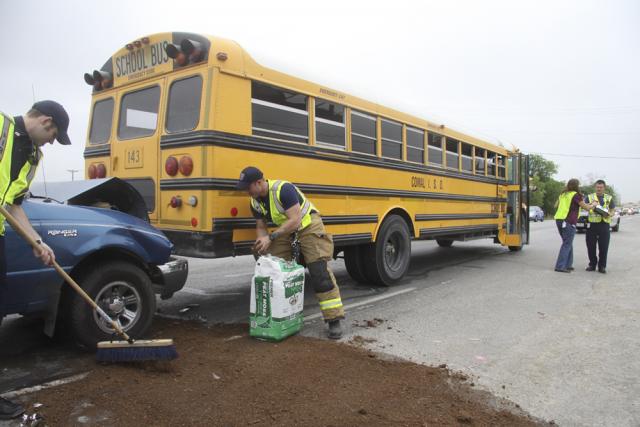 Photo shows School bus rear eded by a pickup truck on April 17, 2013.