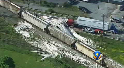 A CSX train plowed into a semi truck that was stopped on the tracks at a rail crossing in Monroe, NC on April 30, 2013 and spilled a load of PVC pipe all over the surrounding area.