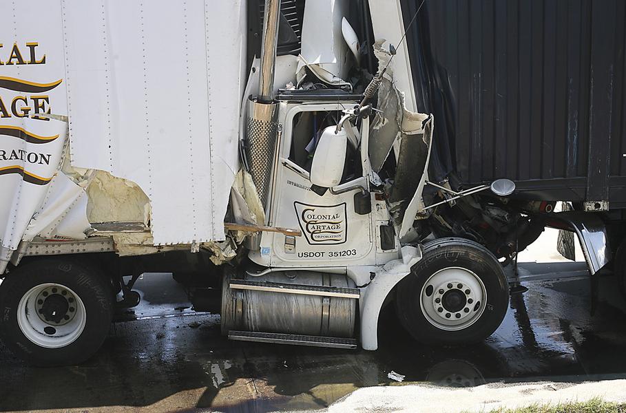 Photo shows damage to tractor trailer after to semi trucks collided on May 8, 2013 in Cecil Georgia. 