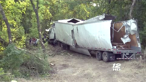 A semi truck driver fell asleep at the wheel on the southbound I-75 and ran off the road into a creek in in Sherman, TX on September 5, 2013.