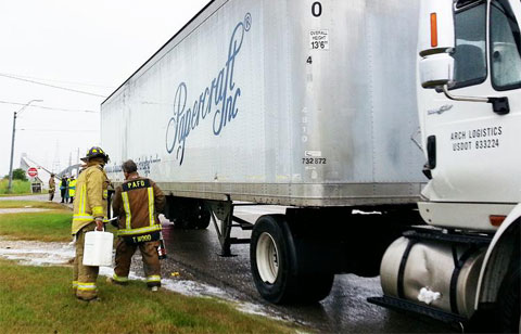 .A semi truck jacknifed on State Highway 73 in Port Arthur, TX spilling diesel fuel and the closure of the Rainbow Bridge on October 31, 2013. Photo credit: Luke Mauldin/The Port Arthur News